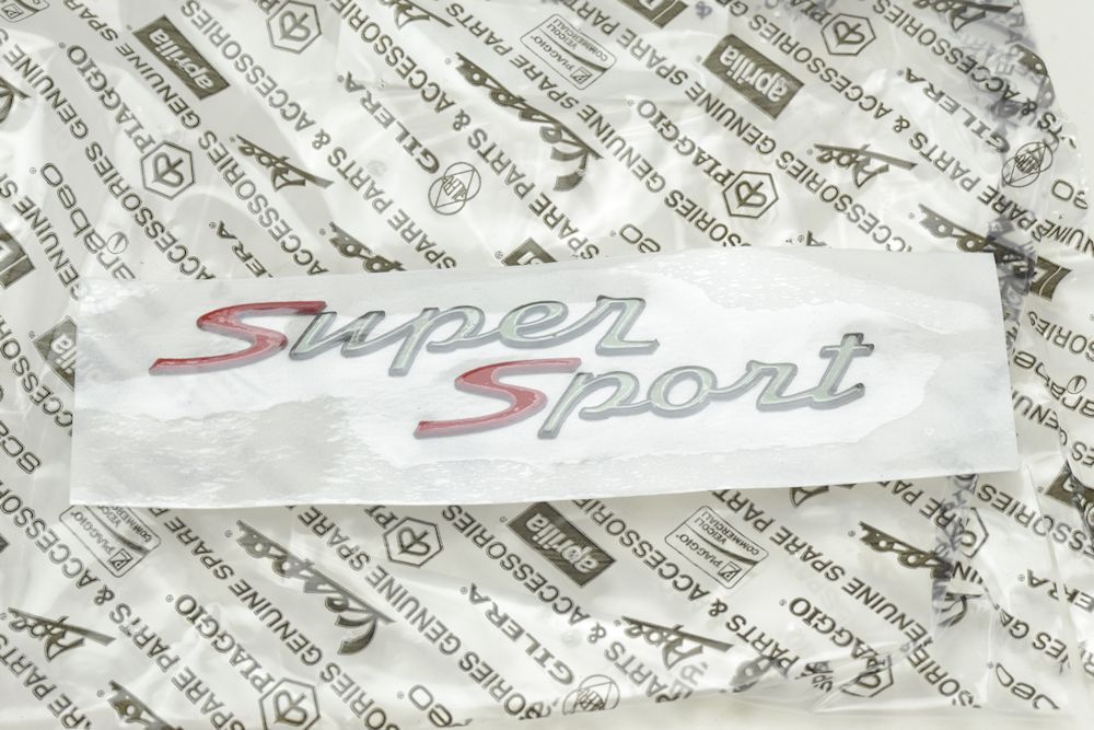 STEMMA VANO PORTAOGGETTI LATERALE VESPA GTS 125/300 SUPERSPORT ORIGINALE PIAGGIO
